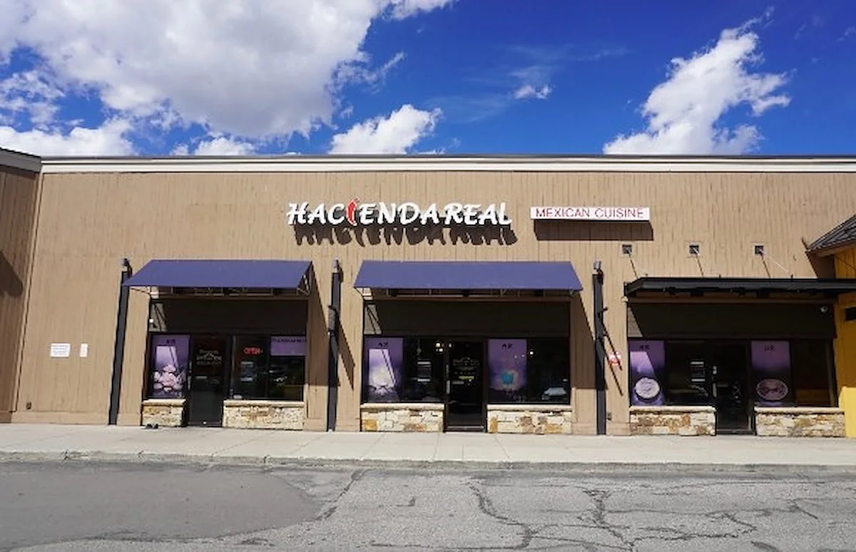 The Hacienda Real storefront at Frisco Station, with the mountains behind the parking lot